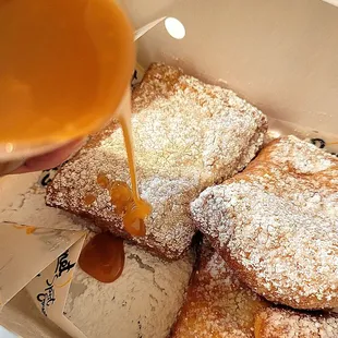 Original beignets with Caramel sauce from Beignet Spot Express