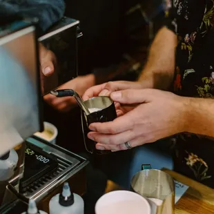 a bari serving a cup of coffee
