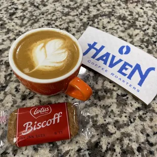 a cup of coffee and a biscuit bar