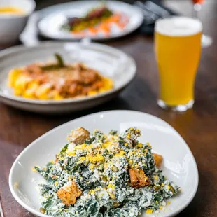 KALE CAESAR  avocado caesar dressing | cotija | pepitas | garlic croutons | sieved egg yolk