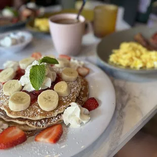 Pancakes with strawberries and bananas.