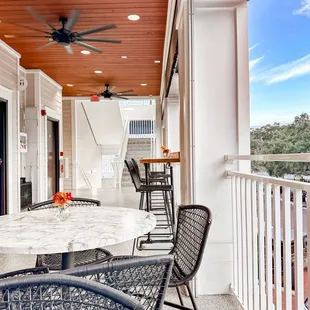 a patio with a ceiling fan