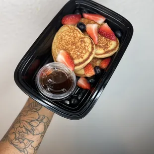 Buttermilk protein pancakes with sugar free syrup, strawberries and blue berries