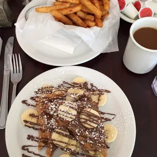 Peanut butter banana french toast with drizzled nutella and one of the best french fries in town, seriously!