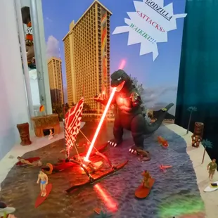 Dale Cripps booth with Godzilla attacking Waikiki.