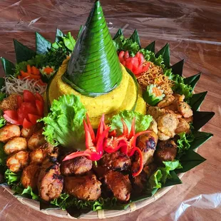 Yellow coconut rice. Nasi tumpeng.