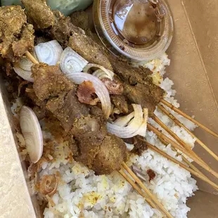 Super delicious chicken satay with peanut dipping sauce. she uses chicken thigh, so it's very tender