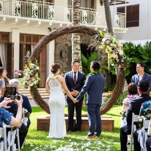 Officiant: Rev. James Chun // Ceremony Venue: Halekulani Courtyard // Wedding Coordinator: A Perfect Day // Arch provided by: Plant Hawaii