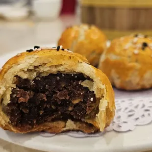 Red bean and tiny portion of salted egg inside, very tasty, flaky and buttery outside.