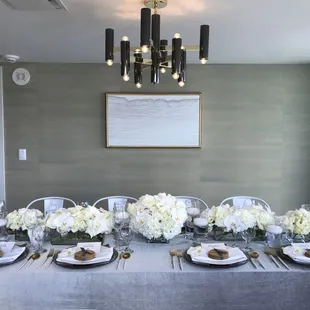 Beautiful grey velvet tablecloth, with our silver shimmer charger and gold and white flatware.