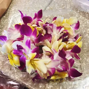 Fresh Plumeria and Orchid Lei. Other varieties available at the back of the store.