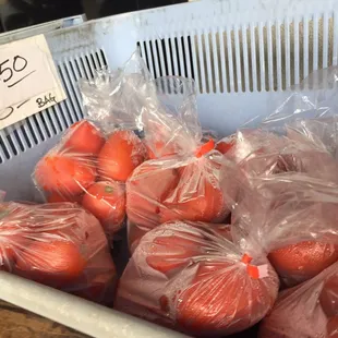 oranges in plastic bags