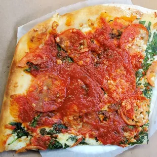 Spinach, Garlic, &amp; Tamato slice, but I asked them to but down some tomato sauce on my slice. ($8.50)