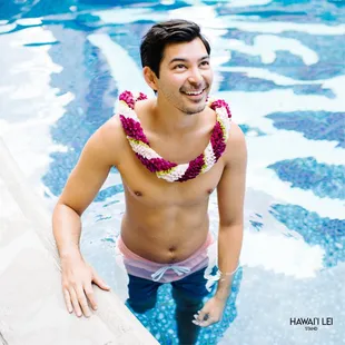 Spiral Lei https://hawaiileistand.com/honolulu-hawaii-lei-stand-by-beretania-florist/spiral-lei-purple-green-white.html