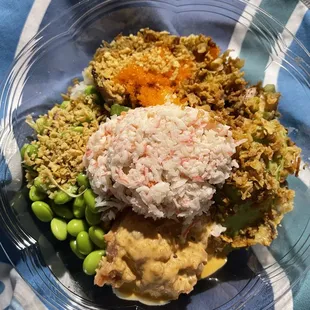 a plate of food on a blue and white towel