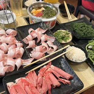 My hubs and I favorite hot pot spot! 2 plates of pork belly 1 plate of premium beef My fav Seaweed noodles and crown daisy