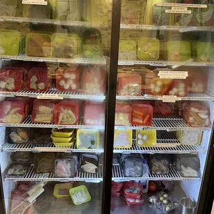 The fridge with more hot pot food to put in your broth! This was the holy heaven section when we found out there was more.