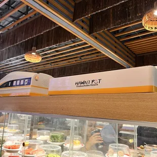 protein is delivered on this train above the conveyor