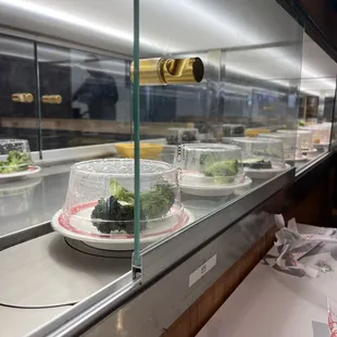 Conveyor belt with items you can take to add to your hotpot