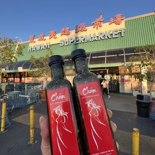 two bottles of extra spicy sauce