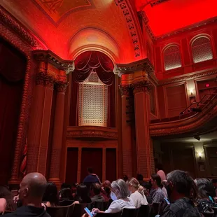 a crowd of people sitting in chairs