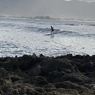 Surfing at pua&apos;ena point with Hawaii Waves Surf School