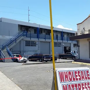 Parking entrance. Right after the Wholesale Mattress.