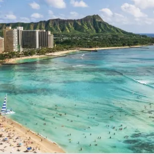 Here&apos;s an aerial view over looking Waikiki beach with Diamond head crater in the background!