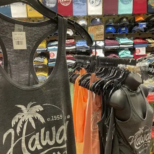 a variety of t - shirts on hangers