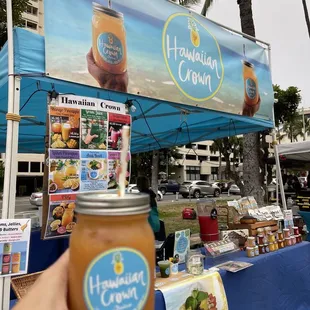 a hand holding a jar