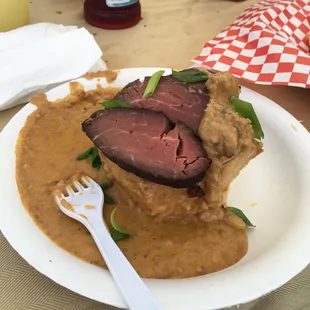 Country biscuits and gravy with tenderloin.