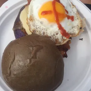 Breakfast sandwich - kiawe smoked local ham with fried egg and havarti cheese on a toasted taro bun with bacon jam!