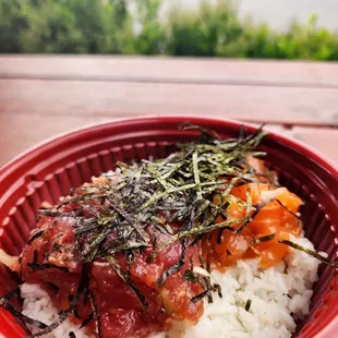 a red bowl of rice and vegetables