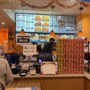 a man ordering food at the counter