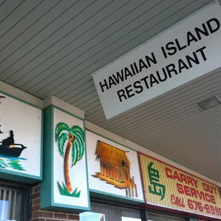 a sign above the entrance to a restaurant