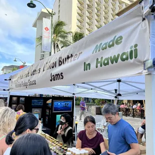 people shopping at an outdoor market