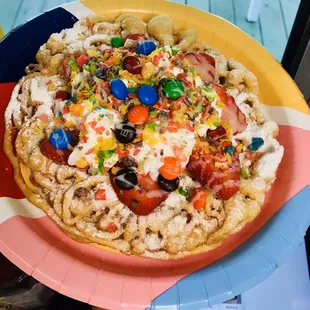 Rainbow  funnel cake , homemade vanilla ice cream , fresh strawberries   Whipped cream &amp; fruti pebbles with m&amp;m   So delicious