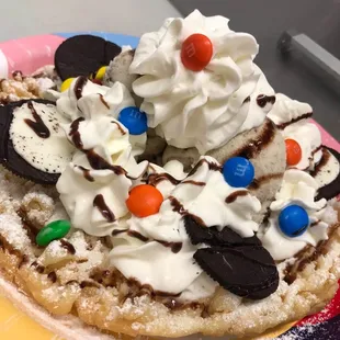 Funnel cake with cookies and cream ice cream chocolate syrup and m&amp;m so yummm