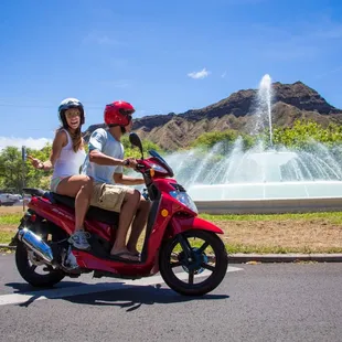 Two Person Motor Scooter riding around Diamond Head.