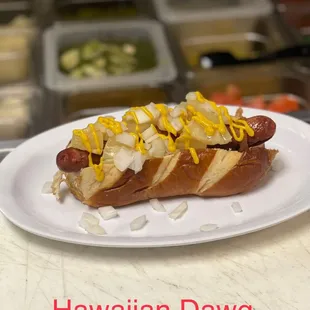 a white plate with a hot dog on it