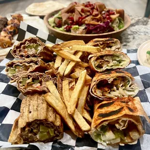 a variety of sandwiches and french fries