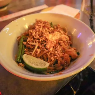 a bowl of stir fried noodles