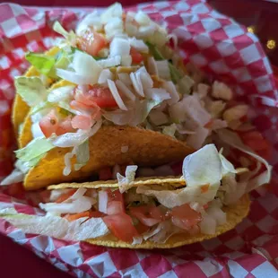 Taco Tuesday: 2 ground beef hard shell tacos for $2.50. We were charged for the standard sides of salsa $0.50 and $1.99 for sour cream.