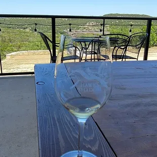 a glass of wine on a table