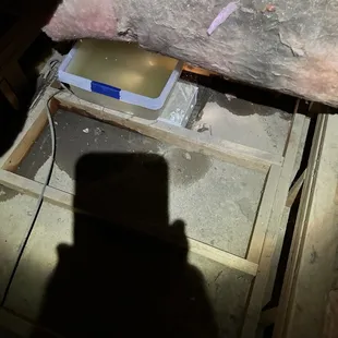 Water collected by plastic bin in attic under Bosch unit as it leaked.