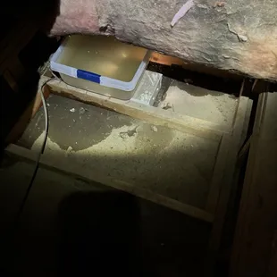 Attic under unit with plastic bin full of water from Bosch unit.