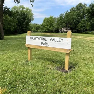 Park Sign Facing Roe Ave and Open Area