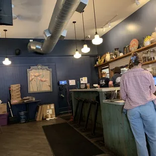 a man standing at the counter