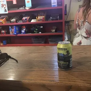 a can of beer on a bar
