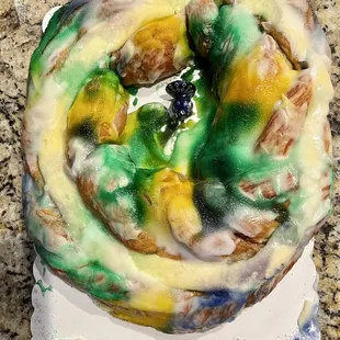 Cream cheese filled king cake- with ceramic Peacock
